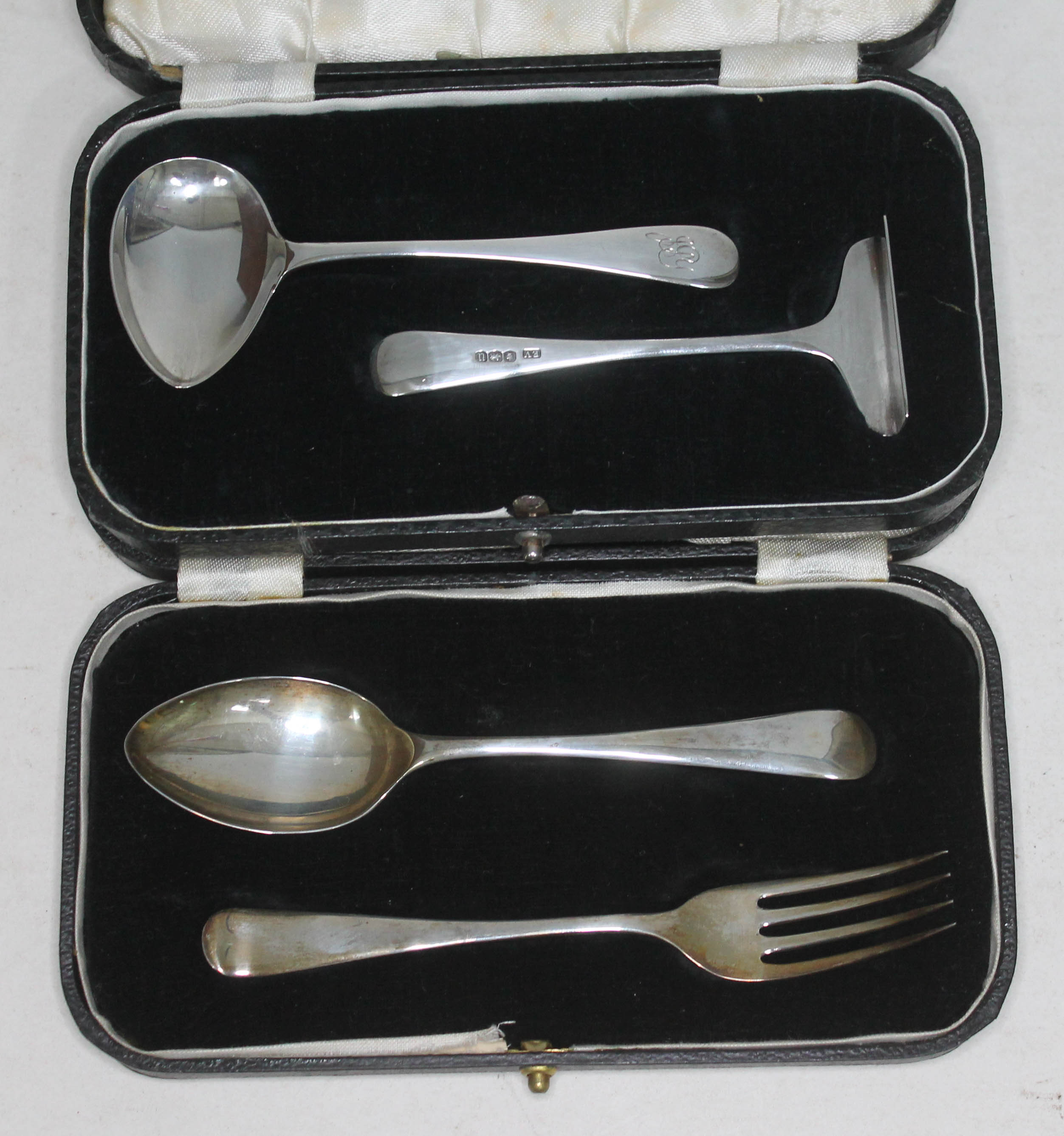 A hallmarked silver pusher and spoon set and a cased Christening set.