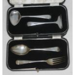 A hallmarked silver pusher and spoon set and a cased Christening set.