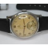 A 1947 stainless steel Omega 13322, with signed tropical dial, Arabic numerals and hands in gold and