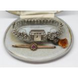 A mixed lot comprising a vintage ladies wristwatch, a brooch marked '9ct' wt.2.46g and a button hook