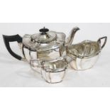 A three piece hallmarked silver tea service, gross wt. 39oz.