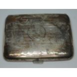 A hallmarked silver cigarette case, wt. 2oz.