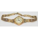 A hallmarked 9ct gold wristwatch with hallmarked 9ct gold strap, gross wt. 12.72g.