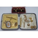A mixed lot including a pair of cased clips set with cultured pearls, two bar brooches, crucifix
