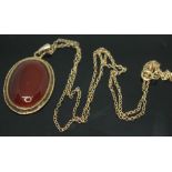 A hallmarked 9ct gold mounted carnelian cabochon pendant, length 36mm, on hallmarked 9ct gold chain,