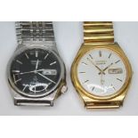 Two vintage Seiko stainless steel quartz day date wristwatches, comprising a Silver wave 7546-8340
