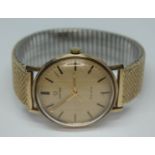 A 1969 hallmarked 9ct gold Omega Geneve 131.25016 wristwatch, with signed gold tone dial, hands and