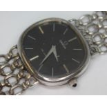 A 1974 silver Omega De Ville dress watch 8390 having signed black dial, silver hour batons and