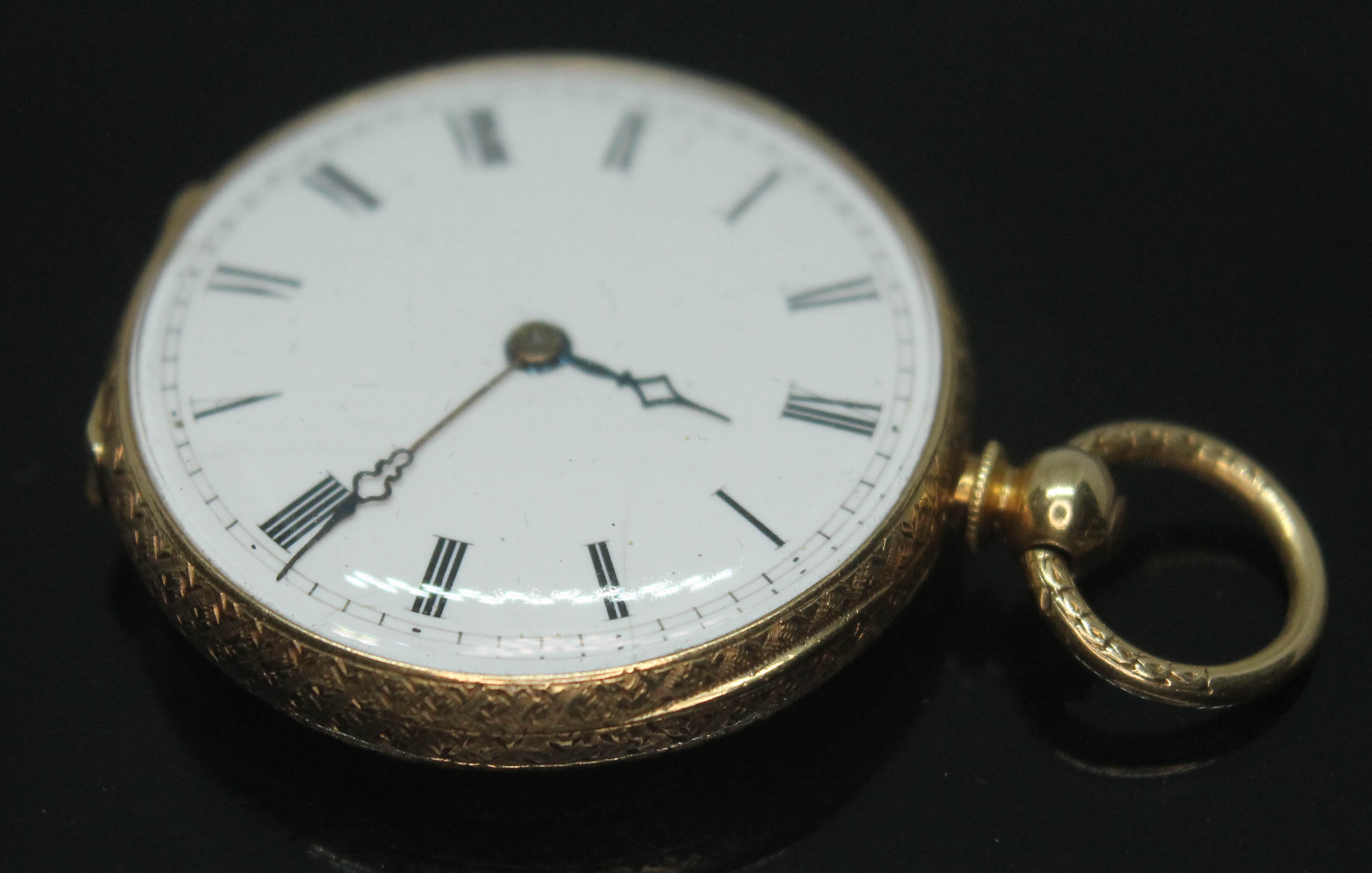A ladies bright engraved pocket watch, marked '18K', diam. 32mm, gross wt. 26.67g. - Image 2 of 8