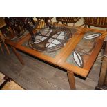 A Danish Trioh Ox Art tile top teak drop leaf coffee table, max. length 140cm.