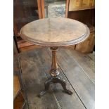 A Victorian burr walnut tripod table.