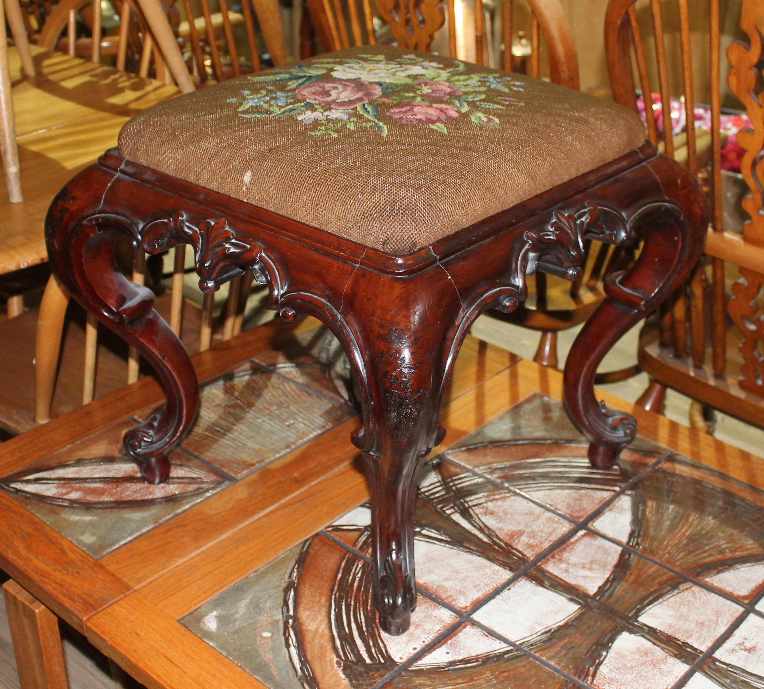 A Victorian carved mahogany stool with tapestry top, width 51.5cm, depth 51.5cm & height 49cm.