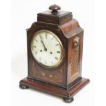 A mahogany bracket clock, twin spring driven movement, brass inlaid case, the sides with gilt