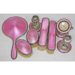 A hallmarked silver and pink enamel dressing table set.