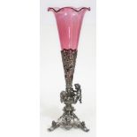 A silver plated centrepiece with cranberry glass trumpet pierced conical holder, base with