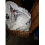 A wicker basket with knitting patterns, material, etc Catalogue only, live bidding available via our