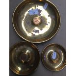 Three brass ashtrays with inlaid coins Catalogue only, live bidding available via our website.