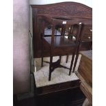 A Continental carved oak mirror back wash stand with carved floral details and beadwork decoration