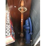 A beech standard lamp with lower carvings Catalogue only, live bidding available via our website.