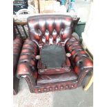 An oxblood leather Chesterfield armchair and matching stool Catalogue only, live bidding available