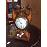 A parquetry inlaid mantle clock Catalogue only, live bidding available via our website. Please
