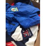 A box of football shirts - L and XL sizes Catalogue only, live bidding available via our website.