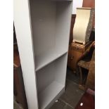 A modern grey bookcase Catalogue only, live bidding available via our website. Please note if you
