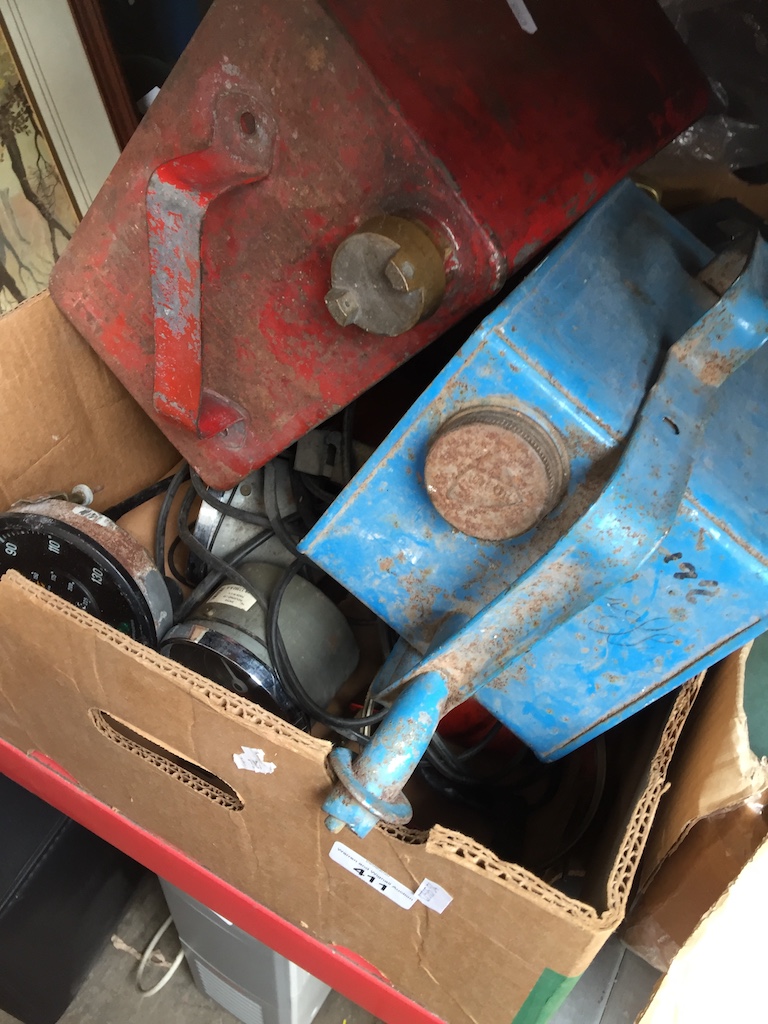 A box of motor related items inc oil/jerry cans, dials, battery, etc Catalogue only, live bidding