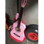 A pink Falcon acoustic guitar and a child's guitar. Catalogue only, live bidding available via our