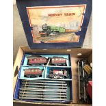 A Hornby clockwork train set Catalogue only, live bidding available via our website. Please note