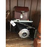 A Kodak Sterling II folding camera with case. Catalogue only, live bidding available via our