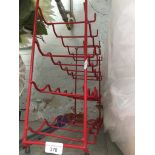 A metal wine rack Catalogue only, live bidding available via our website. Please note if you require