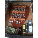 A box with wooden shield spoon display rack and quantity of spoons Catalogue only, live bidding