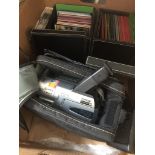 A box of CDs and DVDs and a cased Sony Handycam DCR-TRV130E PAL Catalogue only, live bidding