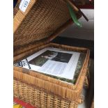 A wicker hamper containing prints Catalogue only, live bidding available via our website. Please