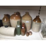 A group of stoneware bottles to include a large John Maxwell jug / pitcher and miniature as well -