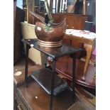 A copper coal bucket and shovel with a table Catalogue only, live bidding available via our website.