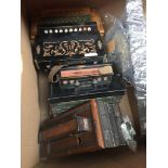 A box containing 4 vintage accordions and a banjo in parts Catalogue only, live bidding available