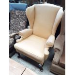 A Parker Knoll wingback armchair Catalogue only, live bidding available via our website. If you