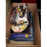 A box of board games and other toys Catalogue only, live bidding available via our website. If you