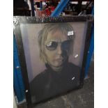 A framed portrait of Paul Weller from The Jam. Catalogue only, live bidding available via our