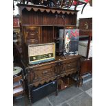 An oak dresser with geometric panels and lower pot board Catalogue only, live bidding available