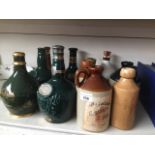 Various pottery whisky bottles etc. Catalogue only, live bidding available via our website. Please