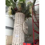 A white painted toilet roll holder adapted as vase for artificial flowers. Catalogue only, live