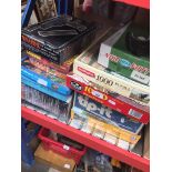 A quantity of jigsaw puzzles and a Binatone TV Master game Catalogue only, live bidding available