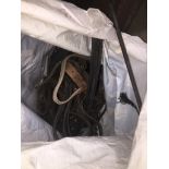 A bag of riding tack. Catalogue only, live bidding available via our website. Please note if you