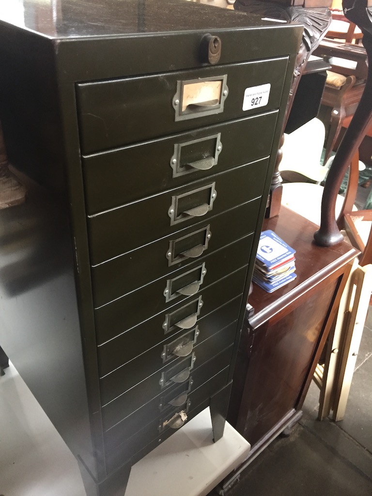A vintage green metal filing cabinet Catalogue only, live bidding available via our website.