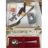 A cased silver teaspoon and other small collectables Catalogue only, live bidding available via