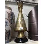 A brass vase on ceramic stand Catalogue only, live bidding available via our website. Please note if