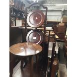 A mahogany cake stand, small round table and magazine rack Catalogue only, live bidding available